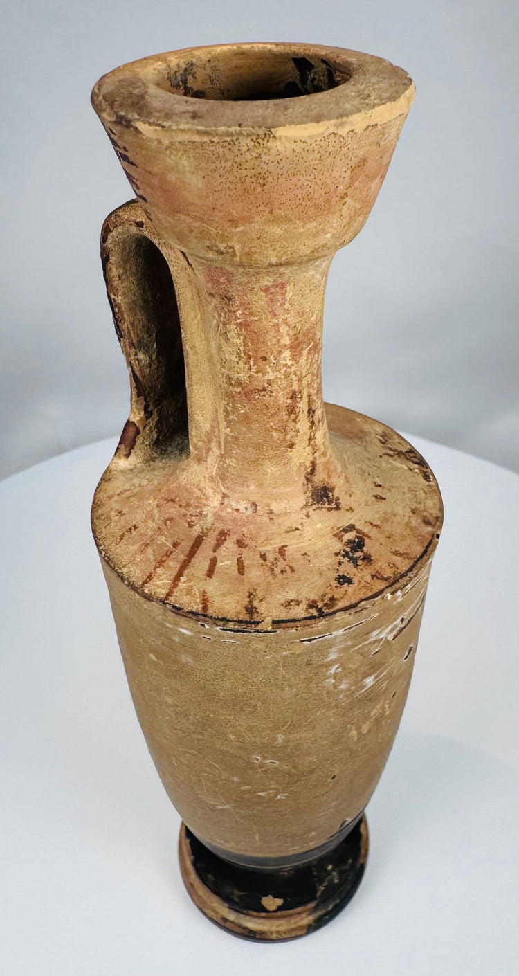Ancient Greek vessel with concentric dark bands around the foot