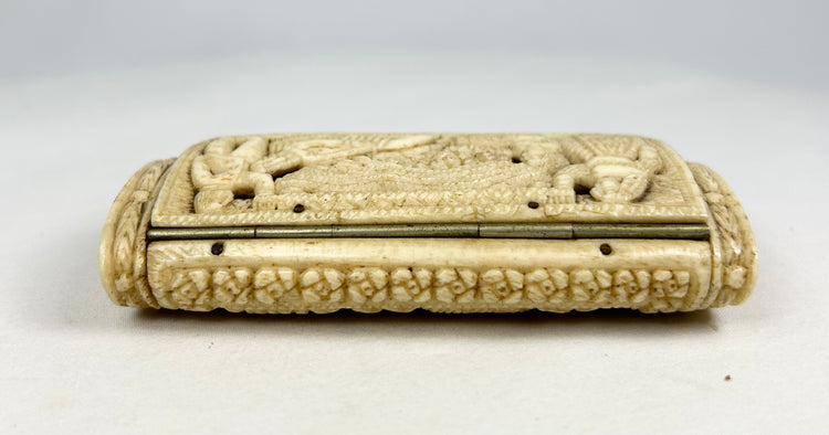 Opposite side of a Napoleonic POW carved bone snuff box featuring carved borders and hinge details on a white background.