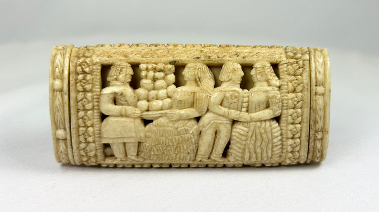Napoleonic POW carved bone snuff box reverse panel displaying multiple standing figures in relief with lattice and floral borders.