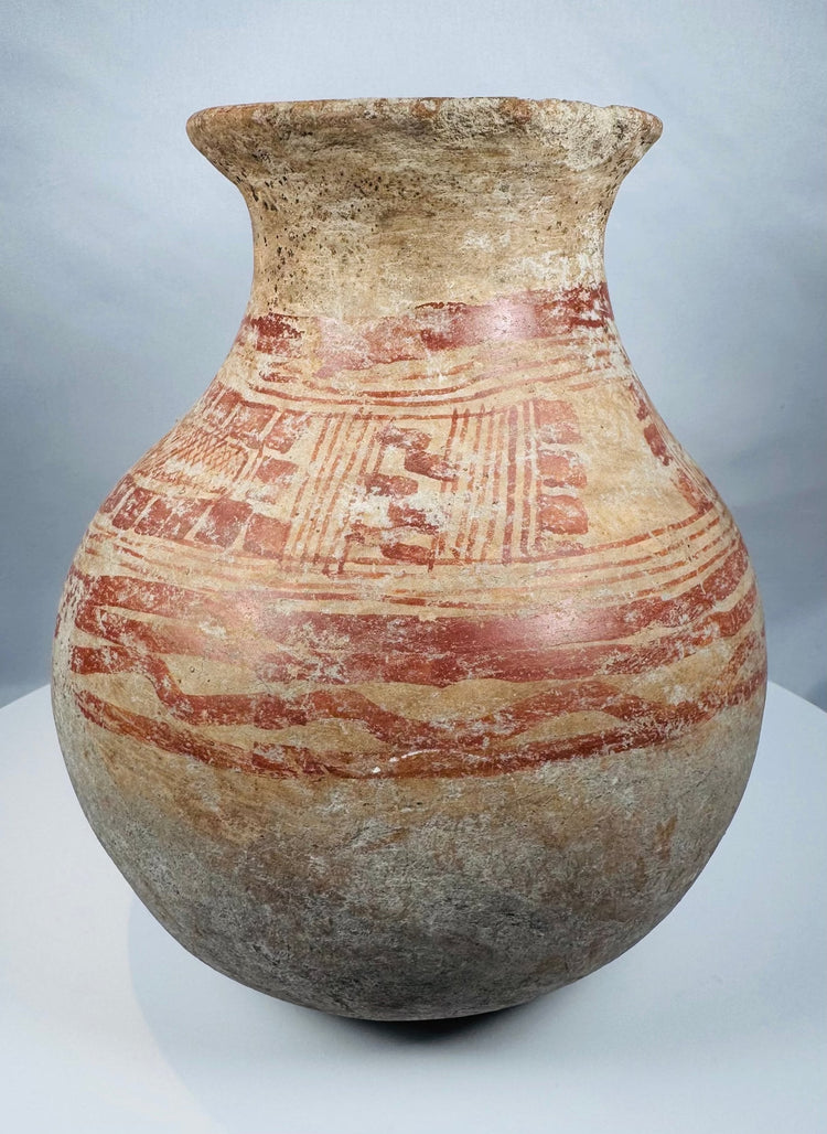 Ancient Central American pottery with red geometric decoration