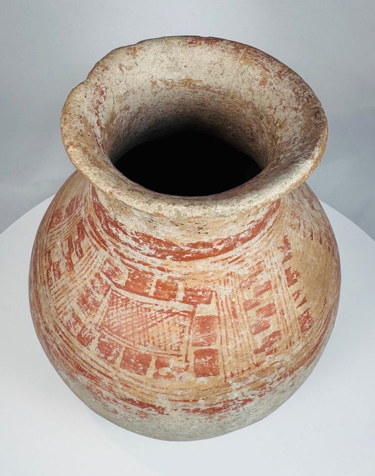 Archaeological ceramic vessel with surviving red mineral pigment
