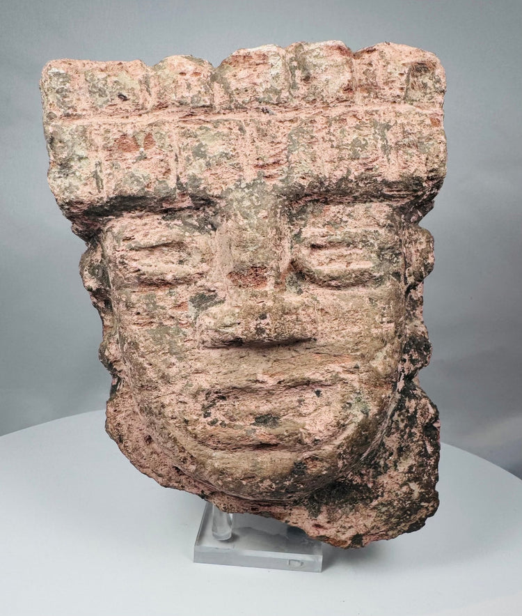 Classic Veracruz stone sculpture with a broad stepped headdress