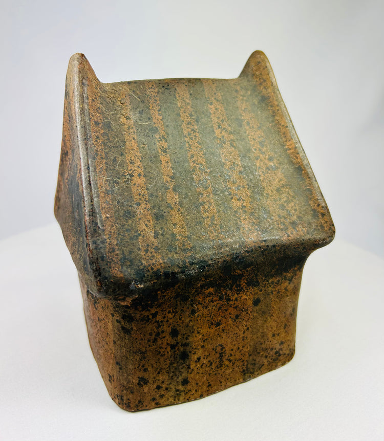 Pre-Columbian architectural model photographed at three-quarter angle.