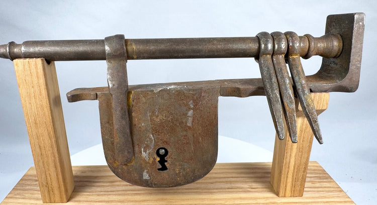 Close-up of the heavy wrought-iron lock body with traditional keyhole opening