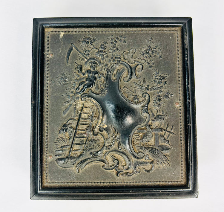 Embossed black Victorian photo case with intricate period design