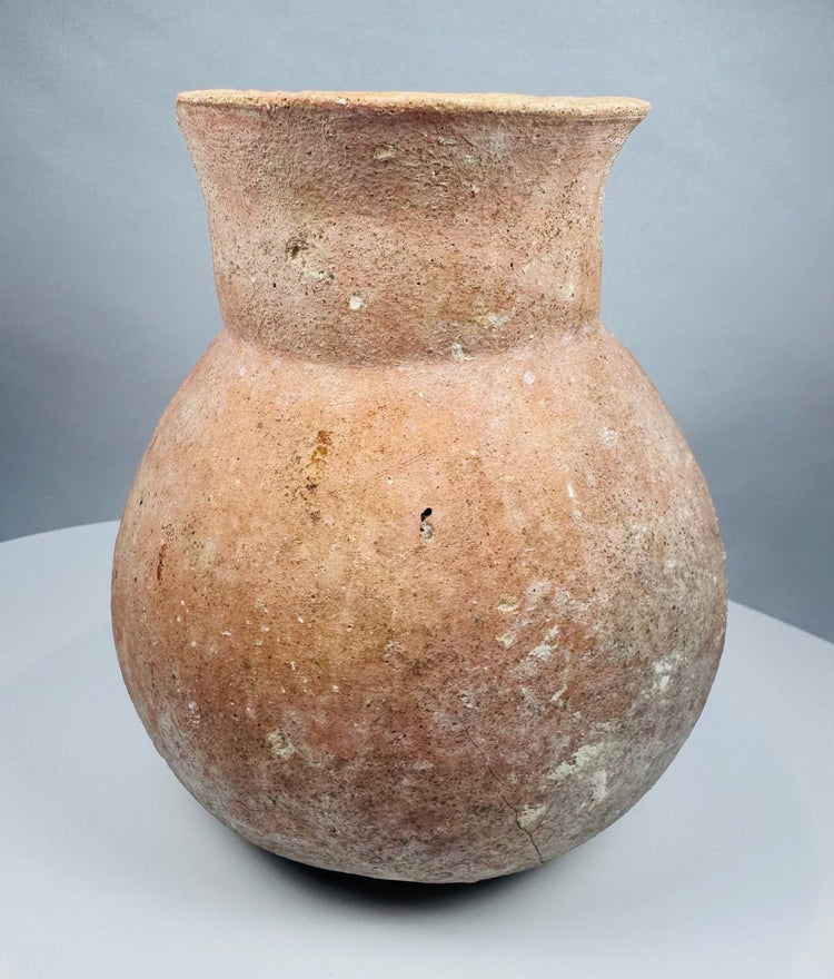 Ancient Central American earthenware jar showing its rounded body and outward-flaring rim