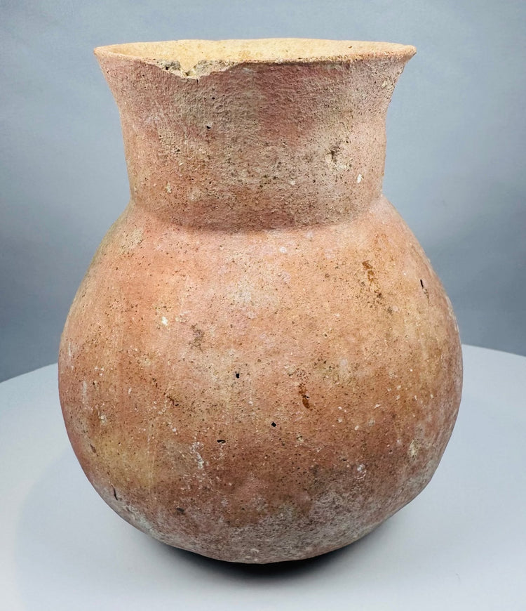 Underside of a Pre-Columbian earthenware vessel showing stabilized cracks and restoration