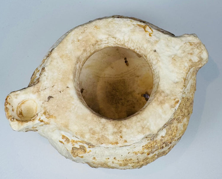 Hand-carved white stone bowl with mineral encrustation and patina