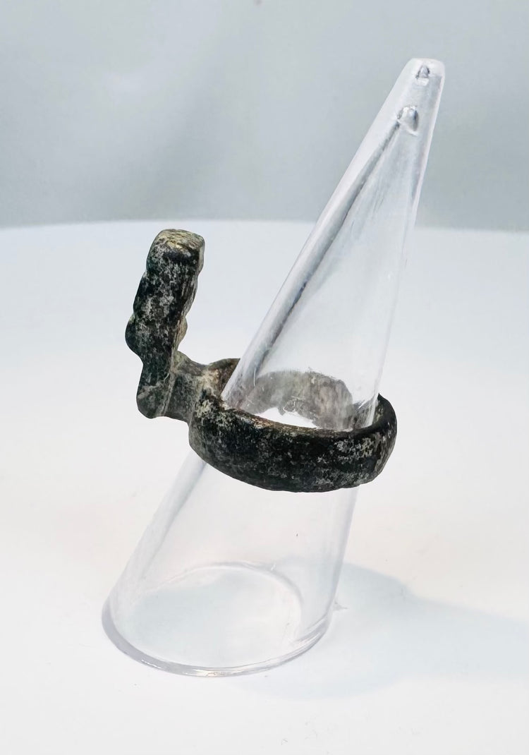 Roman bronze ring key displaying dark green patination, oxidation, and mineral encrustation
