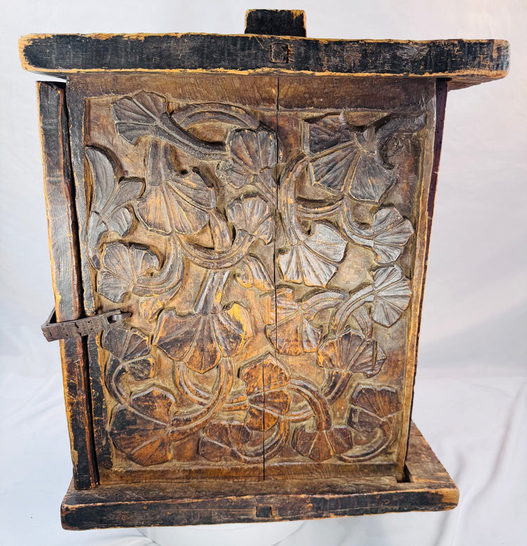 Aged wooden chest with historic cracks, surface wear, and iron hardware