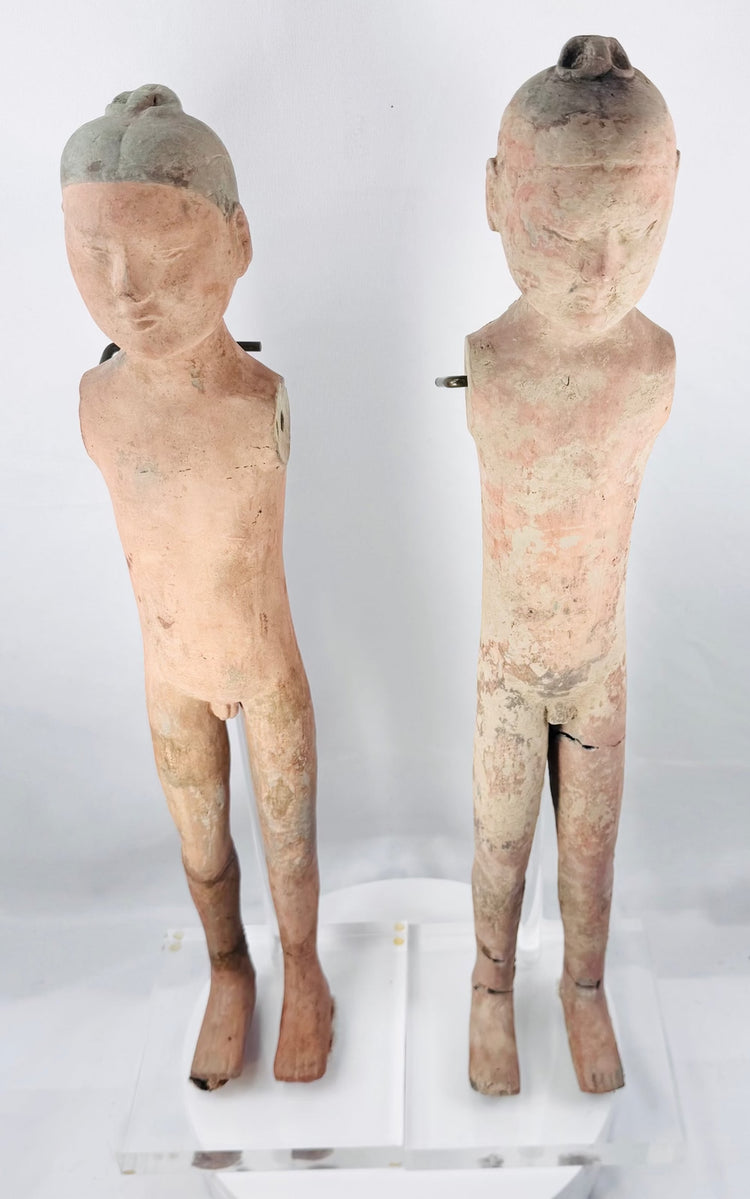Tall Han Dynasty stick figure with elongated body and salmon-pink pigment