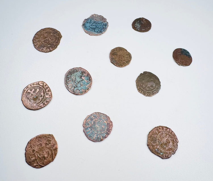 Close details of green and blue-green patination on medieval Crusader bronze coins