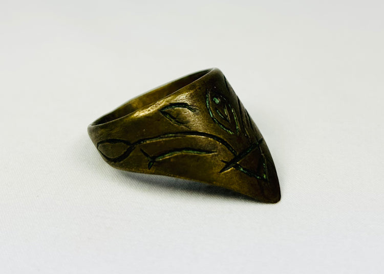 Pointed-front brass thumb ring with green oxidation