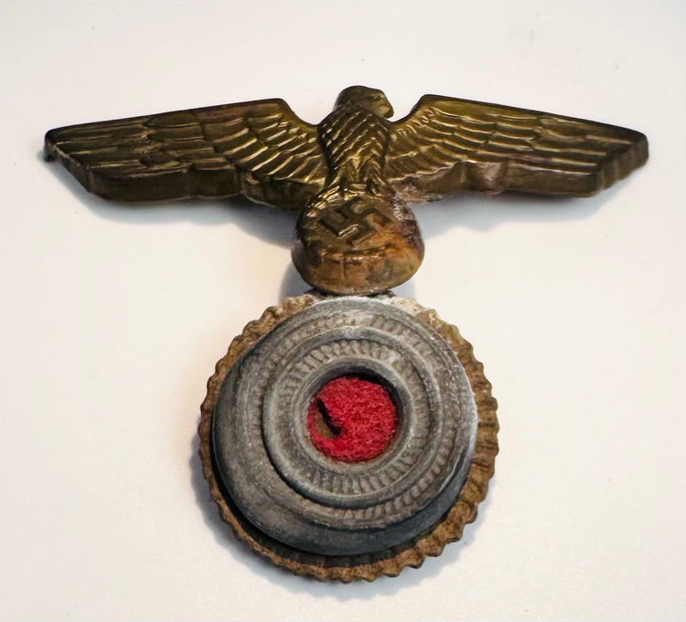 Side angle of WWII German Navy eagle and cockade cap badge construction