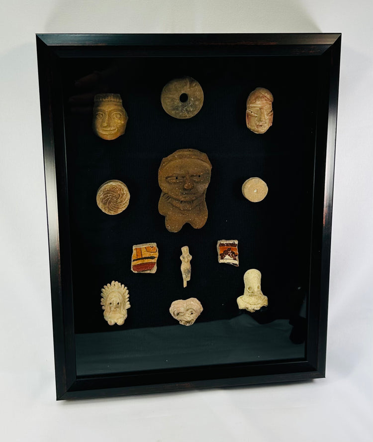 Grouped ancient ceramic fragments and figurines from Central Mexico in a shadowbox