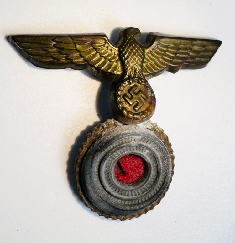 German naval cap badge showing detailed eagle feathers and gilt metal finish