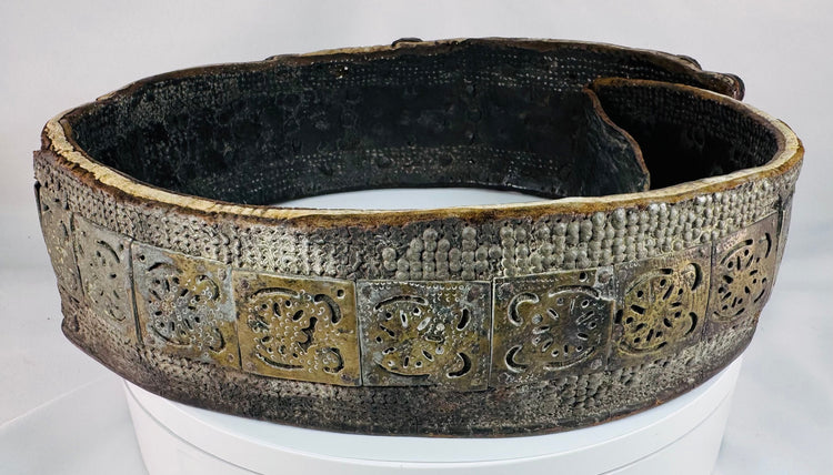Historic Southern Russian wedding belt displaying repeating geometric brass elements and polished orange Cornelian cabochons.