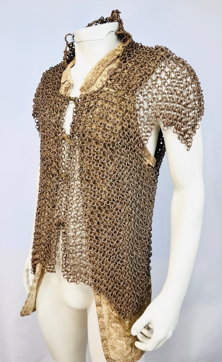 Close view of densely linked metal rings on antique Moro body armour