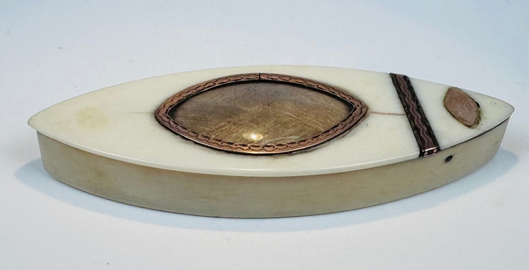 Detail of shield-shaped metal ornament on Georgian bone toothpick case