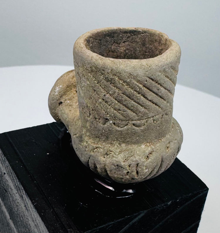 Engraved diagonal grooves decorating an ancient North American stone pipe bowl