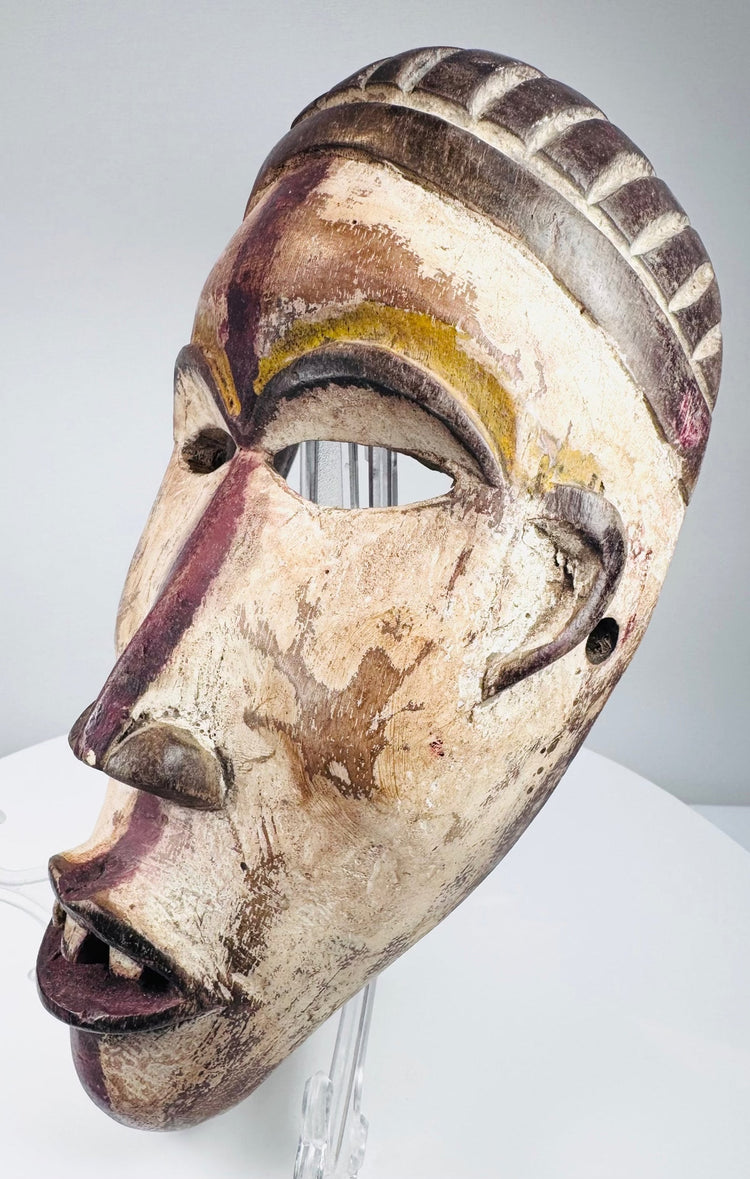 Lower Congo wooden mask with surviving white, yellow, red-purple and brown pigments