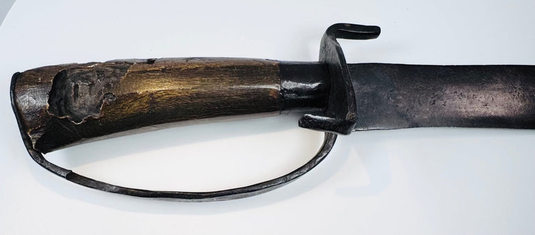 Faceted hardwood grip with historic insect damage on a Colonial North American sidearm