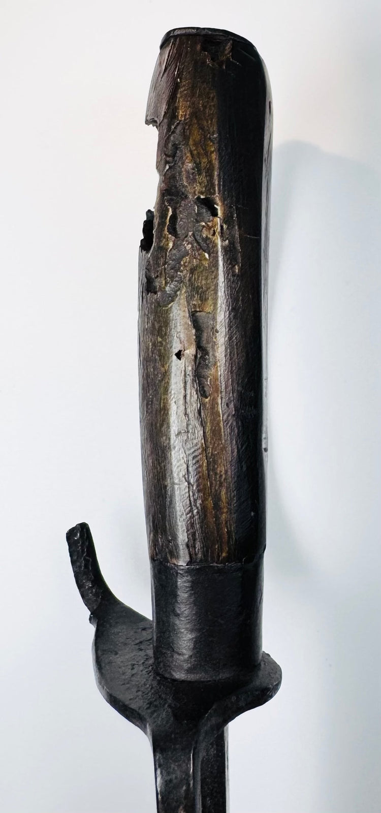 Aged forged steel blade displaying dark patination, oxidation, pitting and tooling marks