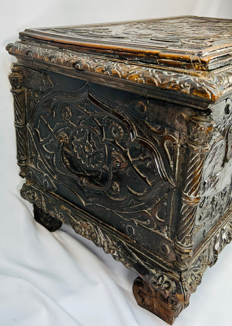 Historic Renaissance marriage chest with figural carvings, foliate borders, and original patina