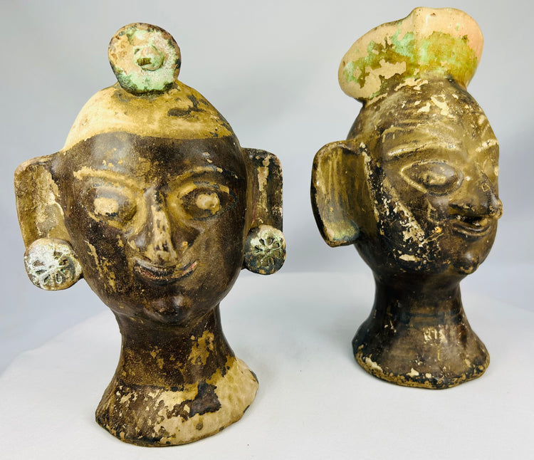 Stylized terracotta portrait heads from Mexico or Central America with bold sculptural design