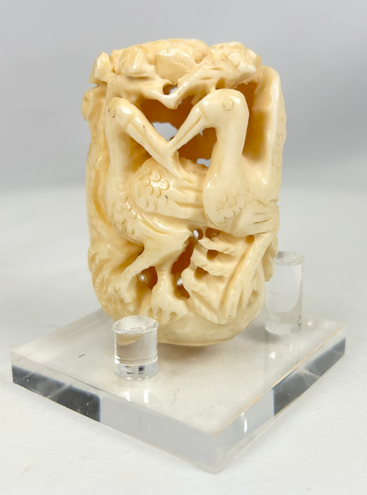 Delicate openwork Japanese bone carving with birds in botanical surround, antique Meiji period piece