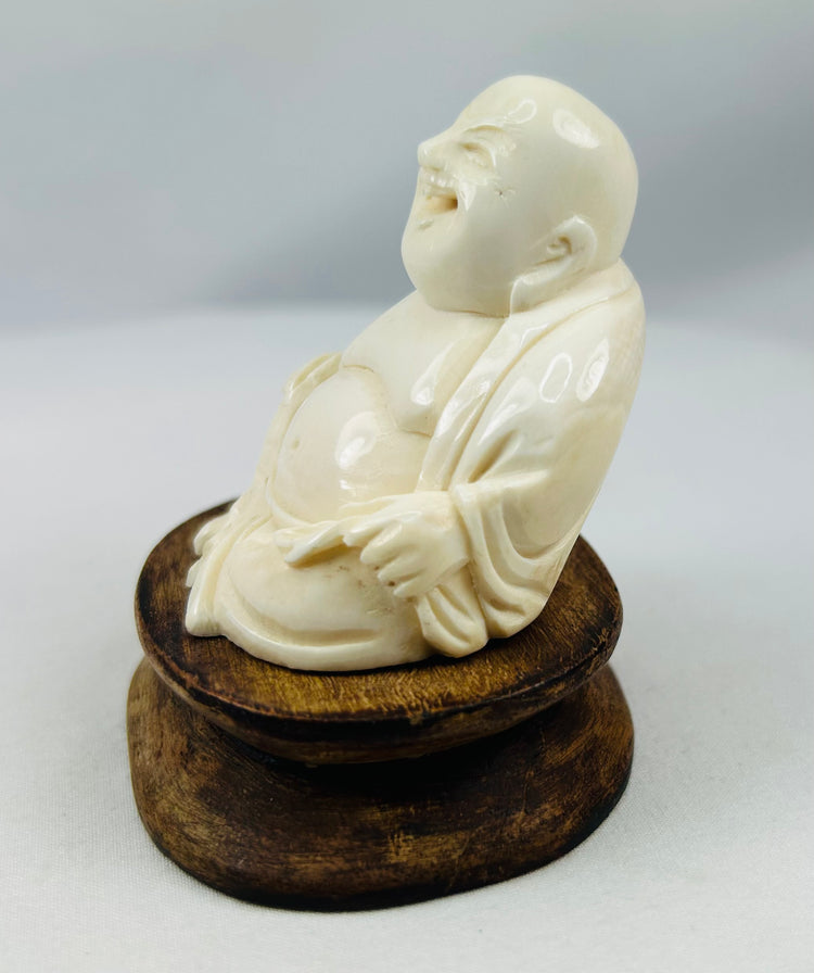 Late 1800s Laughing Buddha figurine with polished finish and robe detailing