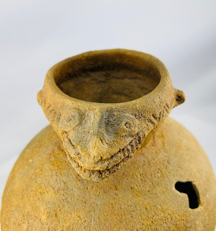 Medieval West African ritual pot with bold reptilian effigy and ridge décor