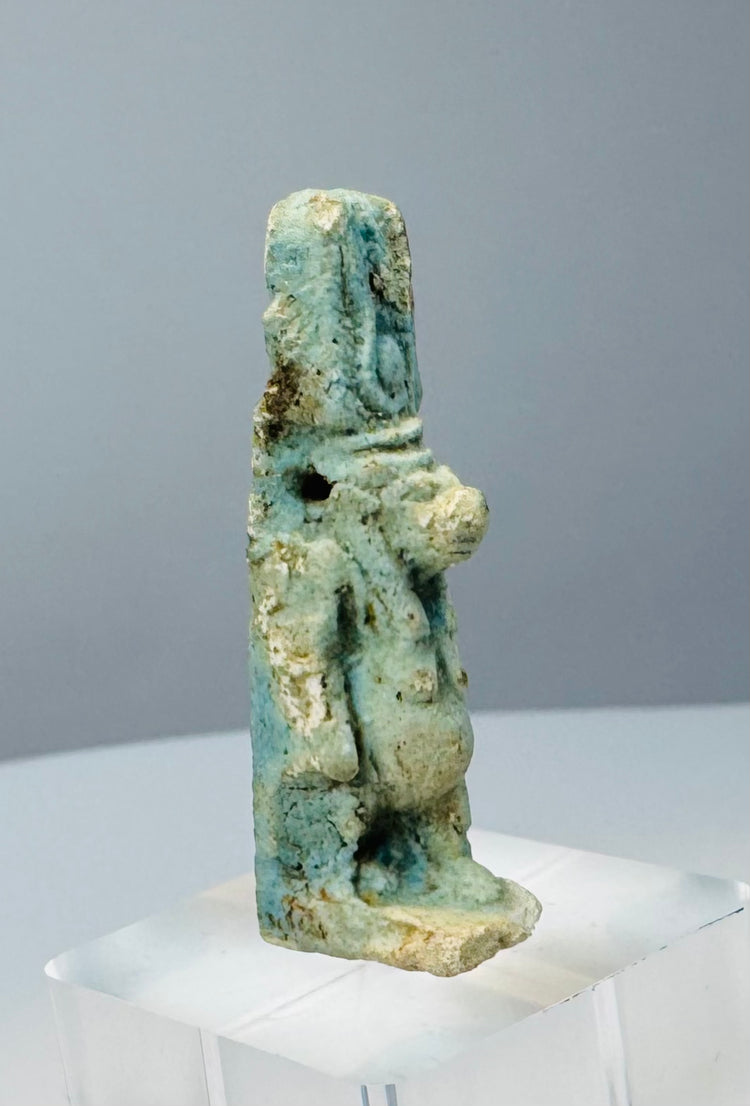 Reverse view of a Late Period Egyptian Taweret amulet showing deep blue glaze remnants