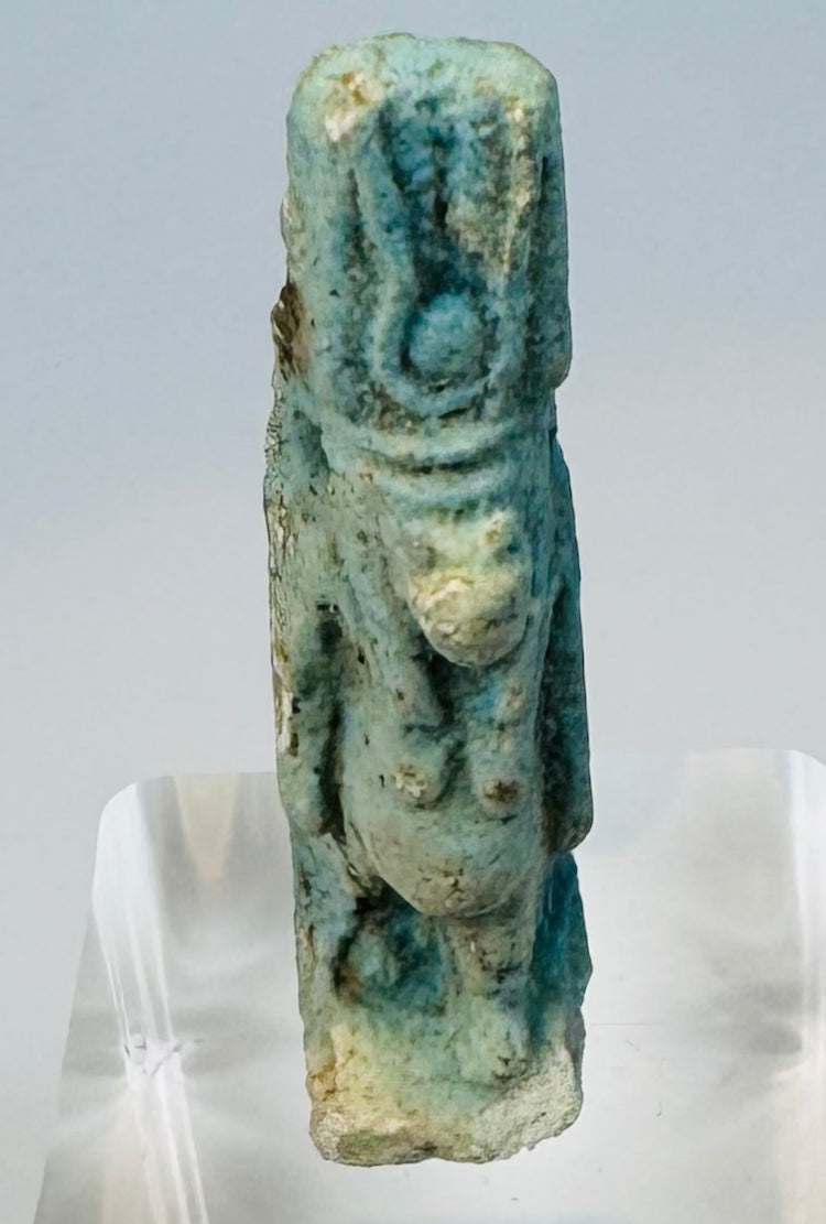 Close view of Taweret’s hippopotamus-like head, headdress and protective divine form