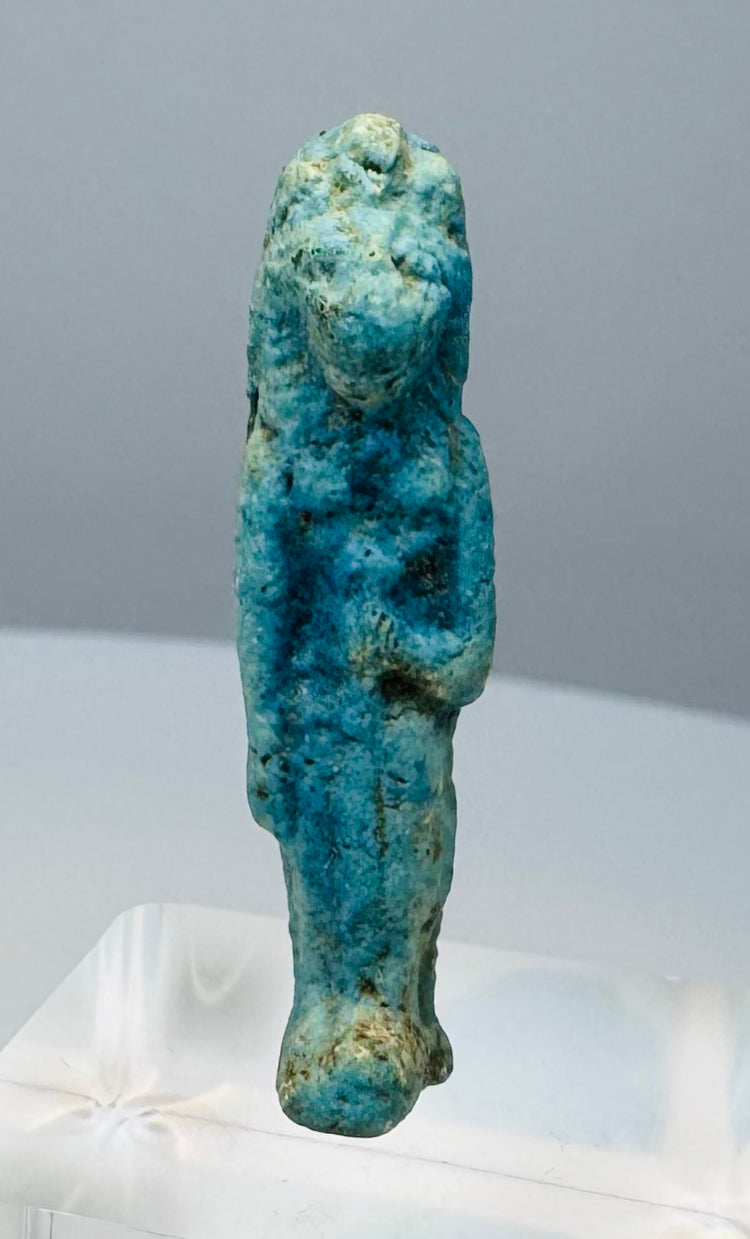 Detail of the transverse suspension hole on an Egyptian Sekhmet or Bastet amulet
