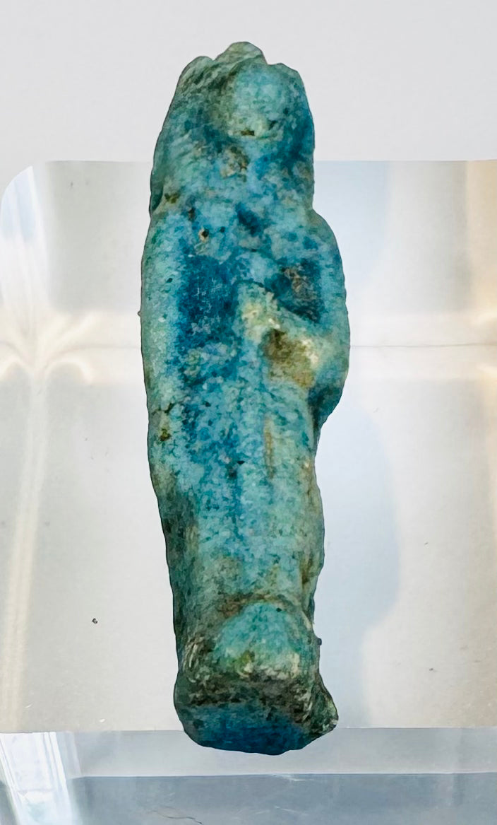 Late Period protective goddess amulet with a bent arm and possible ritual attribute