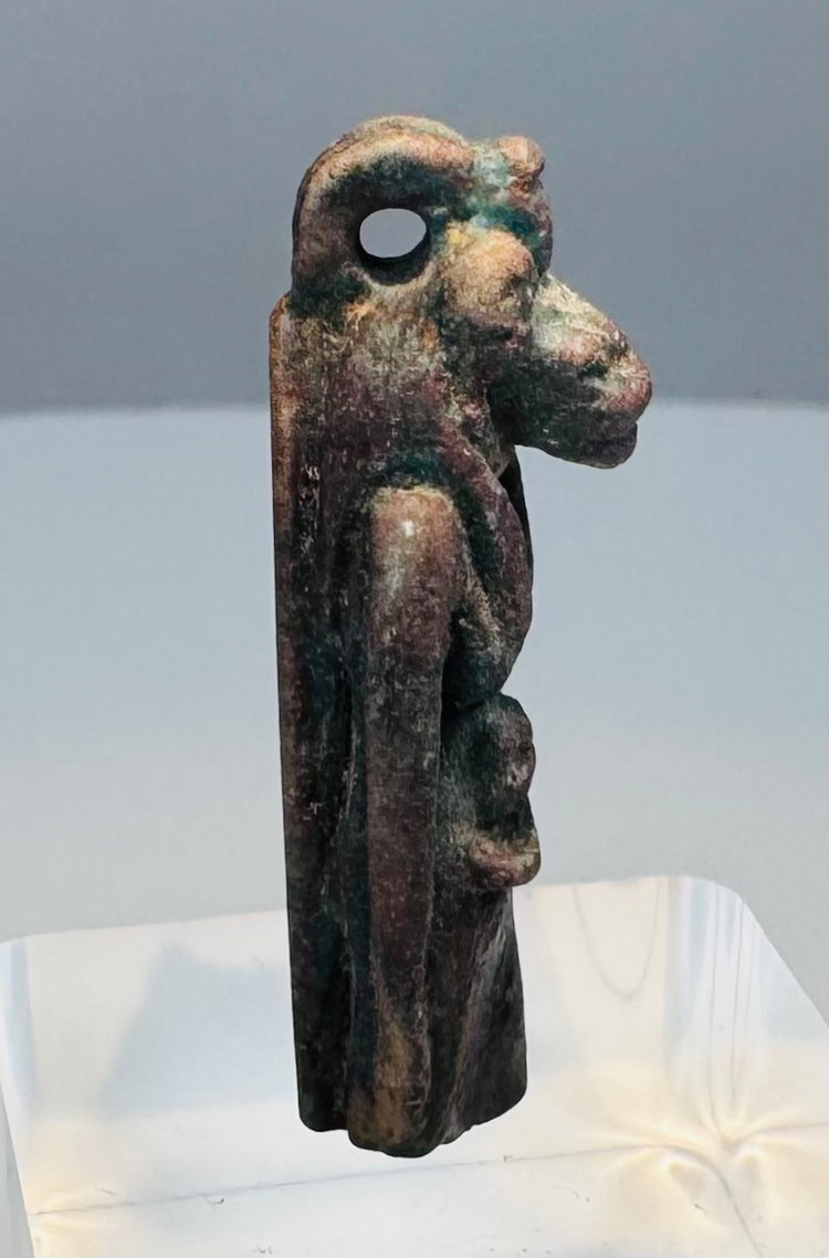Side profile of an ancient Egyptian Sekhmet-attributed amulet with a projecting feline muzzle