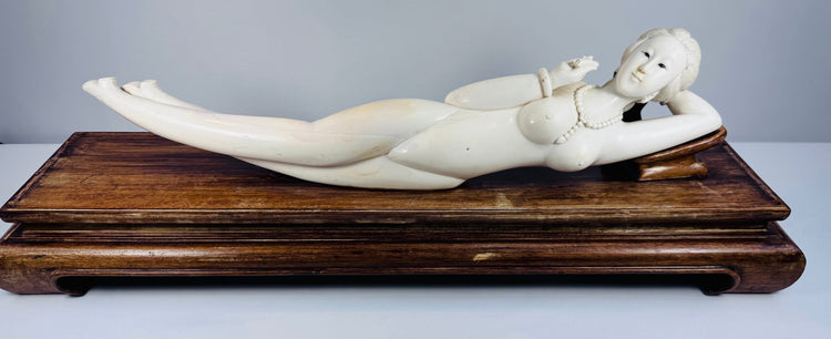 Monumental mid-20th-century Chinese reclining female figure displayed on a custom-carved dark hardwood pedestal