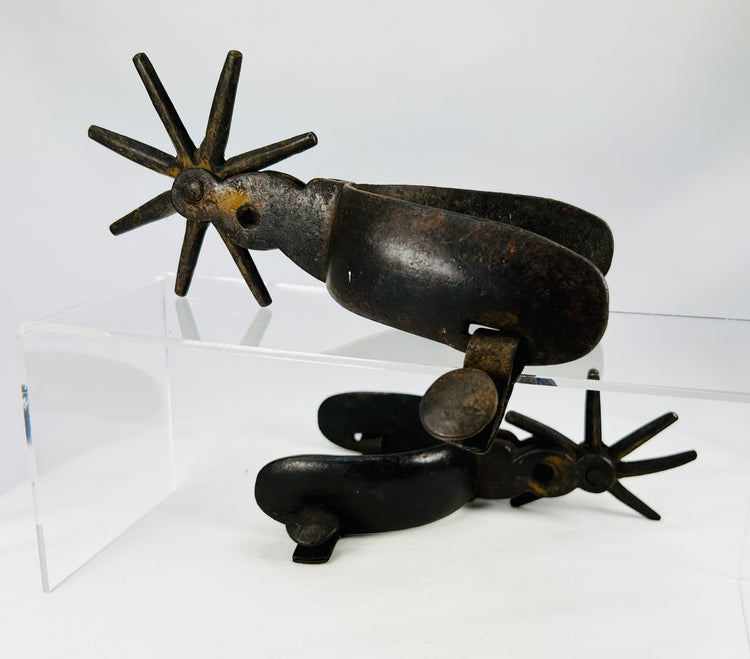 Historic Mexican Charro spurs with sculptural design and star-shaped rowels