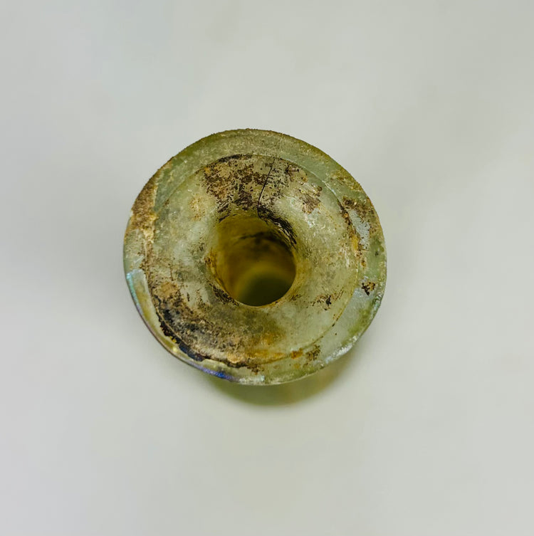 Archaeological Roman glass relic unguentarium used for perfumes and oils