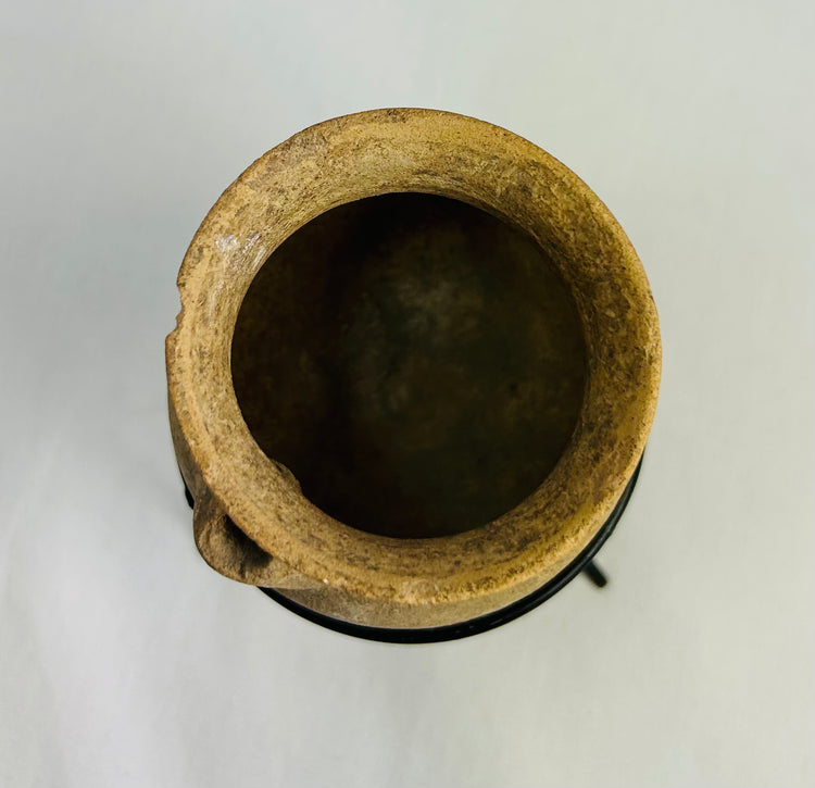Small Roman pottery storage jar with mineral deposits and archaeological surface weathering