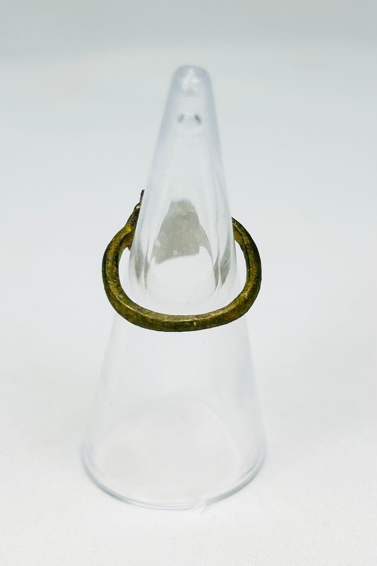 Rear view of ancient Roman bronze ring showing age wear, cracking, and craftsmanship