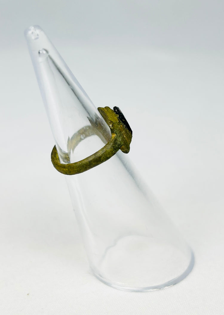 Ancient Roman jewelry artifact with symbolic red glass intaglio centerpiece