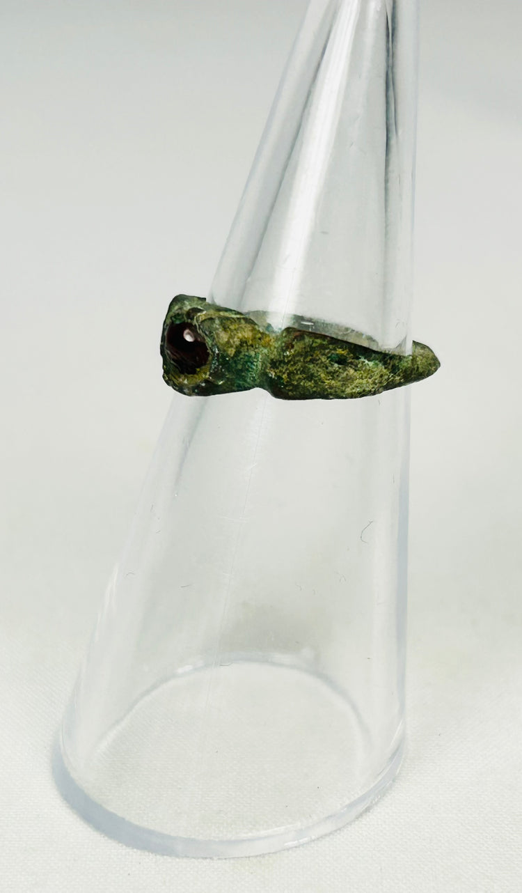 Roman Imperial bronze ring with rich olive-green patina and inset wine-red garnet