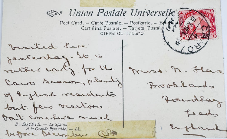 Reverse of an early Egyptian postcard with handwritten message, four-millième stamp, and Cairo postal cancellation