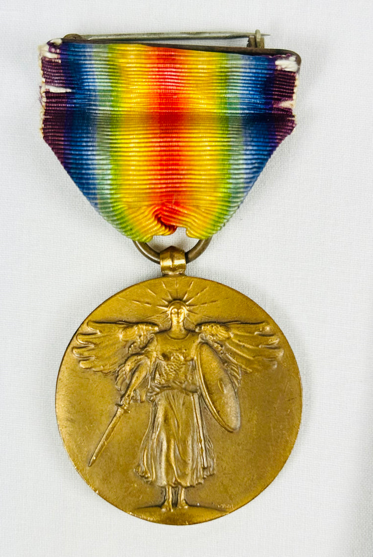 Historic iron strongbox preserving medals, documents, Bible, photographs, and relics