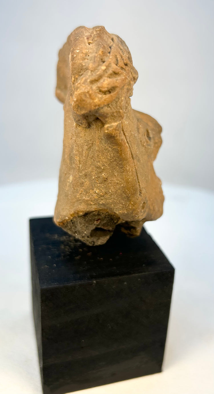 Historical Mesoamerican artifact terracotta head fragment close-up