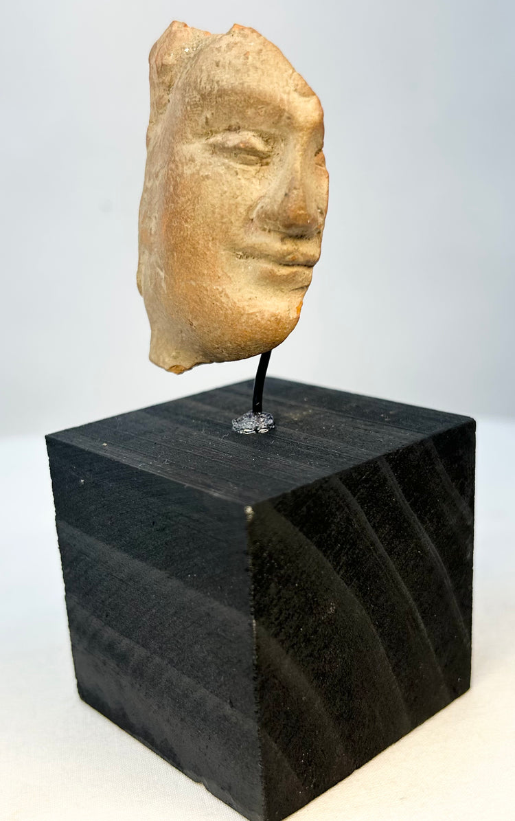 Archaic Classical terracotta face relic mounted for display