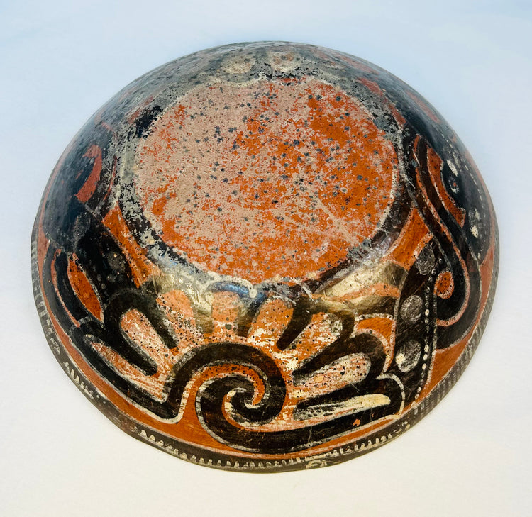 Historic Pre-Columbian ceramic bowl with swirling wave-like designs