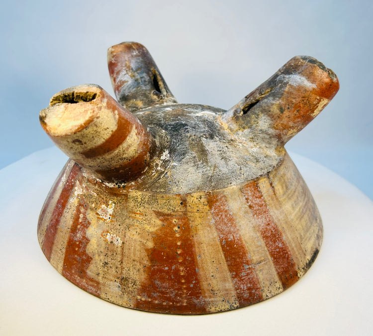 Authentic ancient tripod bowl with weathered painted decoration and patina